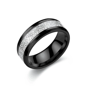 Macro shot of black titanium steel ring with silver frosted texture and inner polished surface