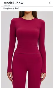 Detail of raspberry red long-sleeved yoga set with high-waist leggings on a model