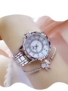 Detail of silver women's watch with rhinestones and matching bow bracelet set