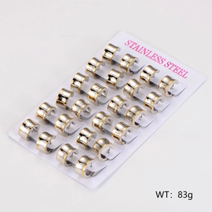 Set of 12 pairs of two-tone stainless steel hoop earrings on a display card, 83g total