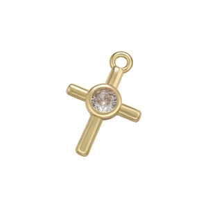 Close-up of golden cross pendant with a central round zircon stone and small ring