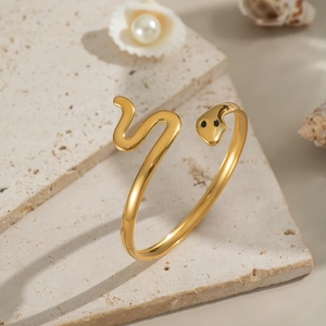 Bracelet serpent élégant en acier inoxydable doré avec yeux noirs et finition polie brillante