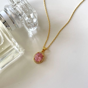 Exquisite 925 sterling silver gold necklace with pink oval zircon pendant on white background