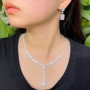 Elegant bridal zircon jewelry set with a layered rectangle pendant necklace and drop earrings