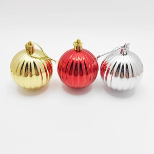 Three-color striped Christmas balls set in gold, red, and silver for tree decoration