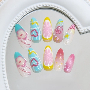 Almond shaped press-on nails with summer fruit party and floral doodle patterns