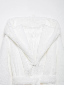 Close-up of white plush faux fur coat texture showing hood and soft interior lining