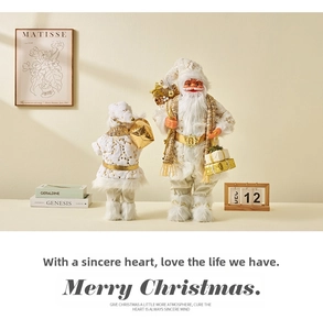 Details von eleganten Weihnachtsmann-Figuren in Gold und Weiß mit floralem Muster