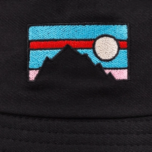 Macro detail of high-density sunrise mountain embroidery on black canvas bucket hat