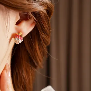 Vintage gold plated strawberry stud earrings with red enamel and sparkling cubic zirconia