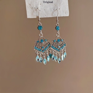 Ethnic fish shell tassel earrings with blue crystals and silver bohemian hollow design