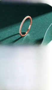 Close-up of minimalist S925 silver eternity rings in rose gold and silver finishes