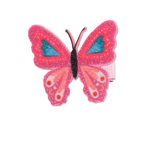 Detail of glitter butterfly hair clip with pink wings and blue floral patterns