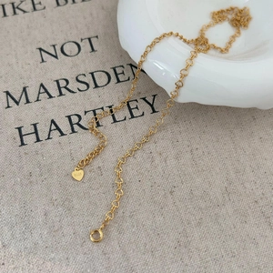 Detail of 925 sterling silver gold heart chain necklace with S925 engraved pendant
