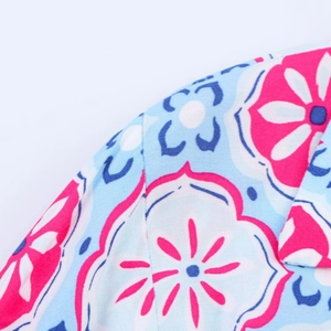 Detailed macro view of the colorful floral print fabric with high density weaving texture