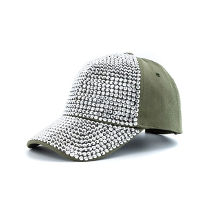 Detailed close-up of army green baseball cap with sparkling silver rhinestones