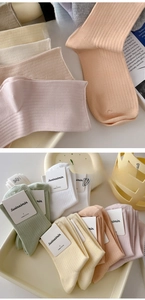 Detailed view of vertical ribbed combed cotton socks in various macaron pastel colors