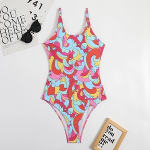 Flat lay of colorful abstract print one-piece swimsuit with high cut design and vibrant swirls