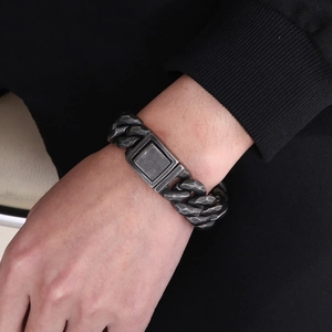 Close-up of men's punk cuban link bracelet with hammered texture and vintage finish