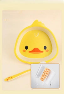 Detailed structure of yellow duck baby plate showing plant-based ink layers and bamboo fiber