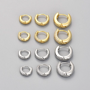 Polished gold and silver hoop earrings set with pavé zircon stones in three sizes