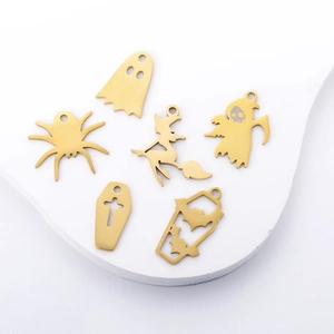 Detail of 6 gold Halloween charms including ghost spider and witch for DIY jewelry