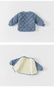 Detail of diamond-quilted toddler jacket with ribbed cuffs and snap button closure