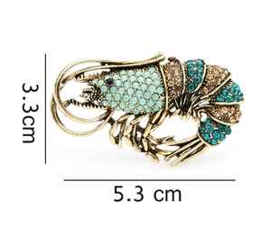 Detailed size view of retro lobster brooch with blue rhinestones showing 5.3cm length