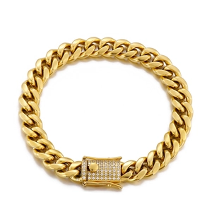 Close-up of golden Cuban link bracelet with diamond-encrusted square buckle on white background