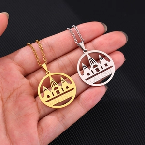 Lalish pendant necklace in gold and silver finish featuring intricate architectural cutout