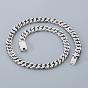 Close-up of polished 12mm stainless steel Cuban link chain with rectangle box clasp