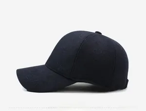 Side view of dark blue wool baseball cap showing premium fabric texture and paneling