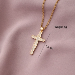 Detail of gold-plated cross sword pendant with cubic zirconia and 3.1 cm dimension