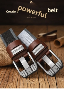Close-up of brushed metal buckle on casual canvas belts with leather trim on wood surface
