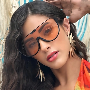 Fashionable oversized wrap-around sunglasses with black frames and orange gradient lenses