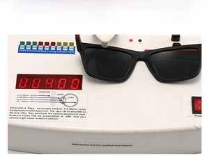 Close-up of polarized sunglasses on a UV400 testing device showing UV protection performance