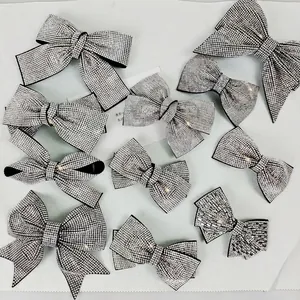 Elegant sparkling silver bow hair clips with full rhinestones in multiple sizes