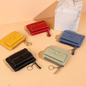 Slim leather coin purse for men and women featuring zipper closure and key ring