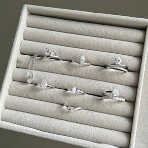 Elegant S925 sterling silver ring collection with teardrop and V-shaped zircon stones
