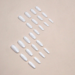 Medium oval press-on nails with white marble eggshell texture and French design