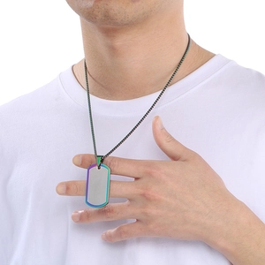 Detail of silver military dog tag pendant with colorful border worn on a male model