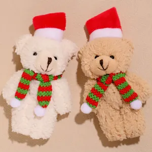 Plush Christmas bears with festive hats and striped scarves for holiday cake decoration
