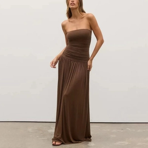 Detail shot of the strapless pleated bodice on this elegant brown maxi dress