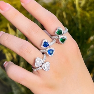Elegant heart-shaped sapphire open rings with pave zircon crystals on silver bands