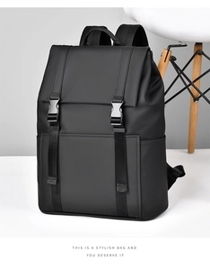 Detail of matte black commuter backpack featuring waterproof fabric and dual buckle closure