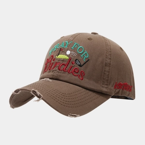Close-up of vintage distressed brim and high-quality golf themed embroidery on brown cap