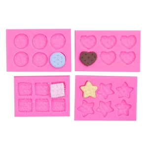 Set of 4 pink silicone molds in heart, star, square, and round shapes for DIY fondant