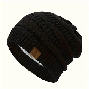 Black cable knit beanie with thick fleece lining and decorative star leather patch