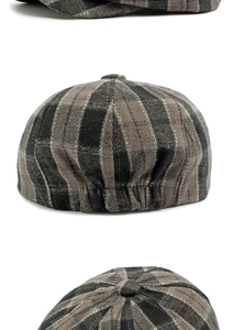 Detail of grey plaid newsboy cap showing wool blend texture and fabric covered button