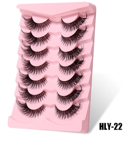 Detail of 7 pairs of fox-eye false eyelashes with clear bands in a pink display tray